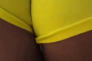 Delicious latin chick arse in yellow and taut bathing shorts