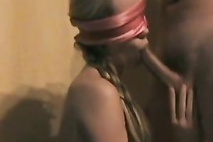 Blindfolded beauty sucks my boner like a pro in front of a webcam