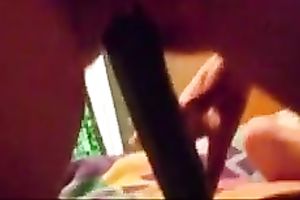 My lustful bedmate satisfies herself with the help of a cucumber