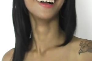 Cute Filipino gal with tattoo on her back is playing with her love tunnel