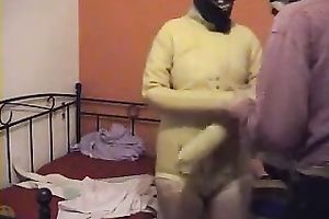 I aid my dirty slut wife to put a latex straitjacket on and tie her up