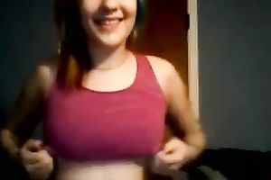 Girl with dyed hair plays with her good muff in webcam solo video