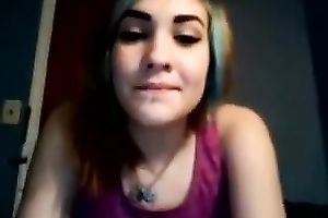 Girl with dyed hair plays with her good muff in webcam solo video