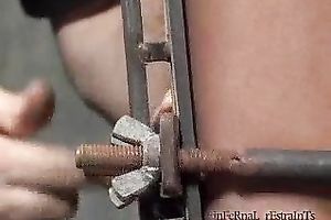 Redhead doxy acquires her scones and legs squeezed in BDSM video