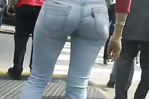 Beautiful latina playgirl in tight jeans walking down the street