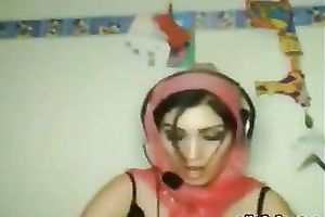 Seductive Indian hooker is posing for cam wearing tempting dark lacy brassiere