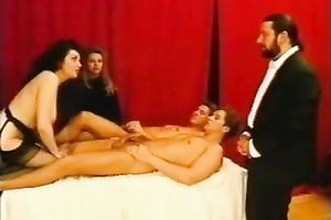 Cock-hungry dark brown acquires sandwiched in retro group sex scene