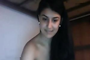 Awesome long-haired brunette hair fingers her fur pie in front of a cam