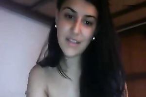 Awesome long-haired brunette hair fingers her fur pie in front of a cam