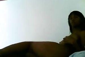 Hot swarthy cam model with a pierced navel strokes her muff like guitar