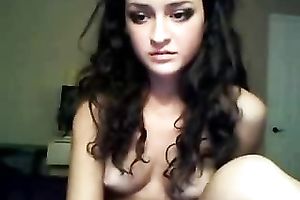 Curly haired beauty with tasty boobs is finger banging her fuckhole