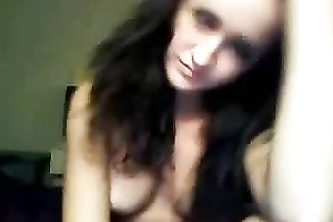 Curly haired beauty with tasty boobs is finger banging her fuckhole