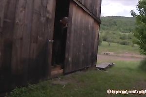 Redhead hottie bounded outdoors walks behind her master's car