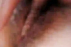 My Asian bedmate fingers her curly crotch to orgasm