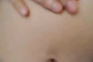 My Asian bedmate fingers her curly crotch to orgasm