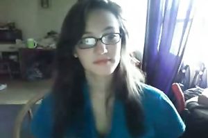 Cutie sweetheart in glasses having pleasure on livecam by masturbating