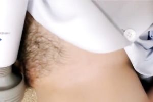 Naughty Asian nympho tickles her snatch with her Hitachi wand