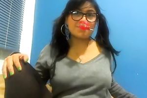 Young and large boobed dark brown undresses in front of the camera