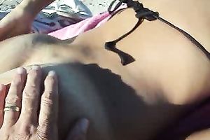 I just lay here rubbing my swollen rod with my hand on the beach