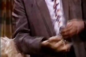 Bosomy blond gives her paramour a great oral stimulation right in his office