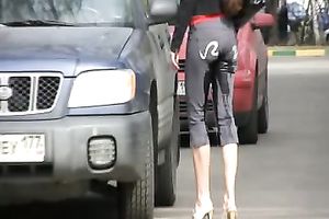 Juicy Russian dark brown black cock slut hides behind the car and urinates