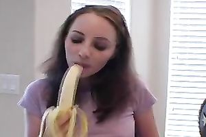 Teen honey eats banana as if it is a juicy clean 10-Pounder