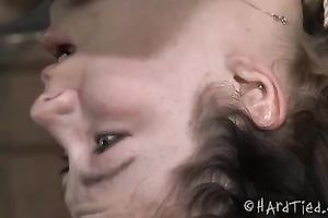 Slim dark brown chick with pale skin bounded with her head upside down