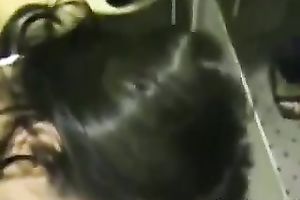 Buxom slut with jet dark hair gives head in the changing room