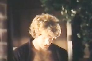 Retro clip with a sexy brunette hair giving hand to a fellow in the bedroom