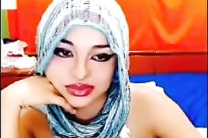 Paki doxy in scarf shows her breasts and fingers her pussy