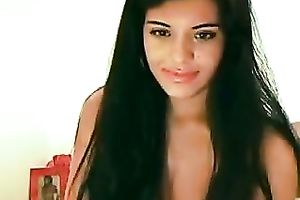 Full figured Latina brunette hair chick plays with her puffy cookie on cam
