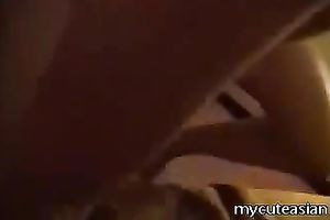 Homemade movie scene with dilettante Asian pair banging in the missionary pose