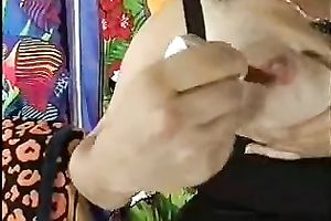 Webcam solo vid with a plump Asian babe playing with her large milk cans