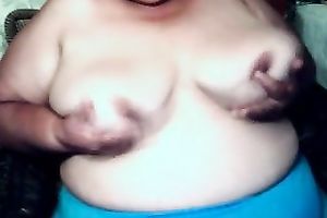 Chubby short-haired granny shows her bazookas and twat for the web camera