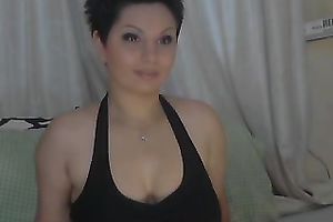 Short haired web camera model with large boobies can't live without fooling around