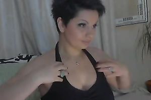 Short haired web camera model with large boobies can't live without fooling around