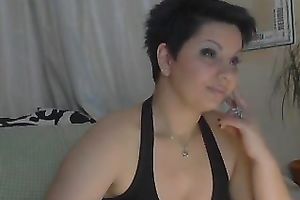 Short haired web camera model with large boobies can't live without fooling around