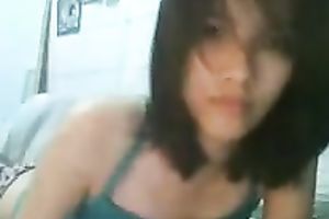 Sweet Asian kinky wife is taking off her raiment on web camera