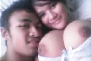 My spicy hot Asian girlfriend with large mangos likes cowgirl position