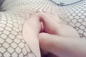 Hot wench in fishnet bodystocking lets me fist her shaved cookie
