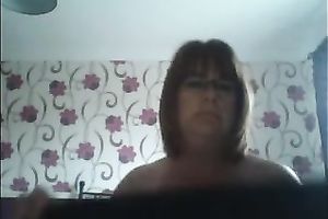 This four eyed granny is rubbing her chunky pussy like insane