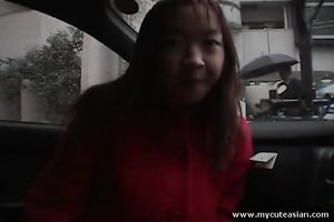 Shamelessly exhibitionistic Asian nympho flashes her milk shakes in a car