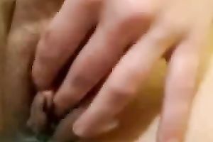 Redhead hussy shows her vagina for the web camera and stuffs it with something