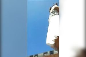 Sexy BBC slut in her white short petticoat walking on the street