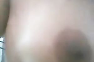 Stripping in front of a webcam and showing my tits for the web camera