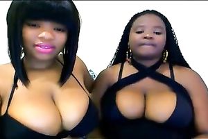 Two buxomy ebon nymphos are showing off their large boobies