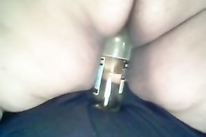 My overweight black cock sluts masturbates her anal opening with a bottleneck