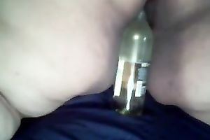 My overweight black cock sluts masturbates her anal opening with a bottleneck