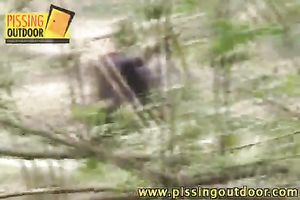 Two wicked sluts pee in the forest after smokin' cigarettes