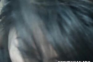 Asian beauty shows her bazookas to a fellow and works on his tiny rod